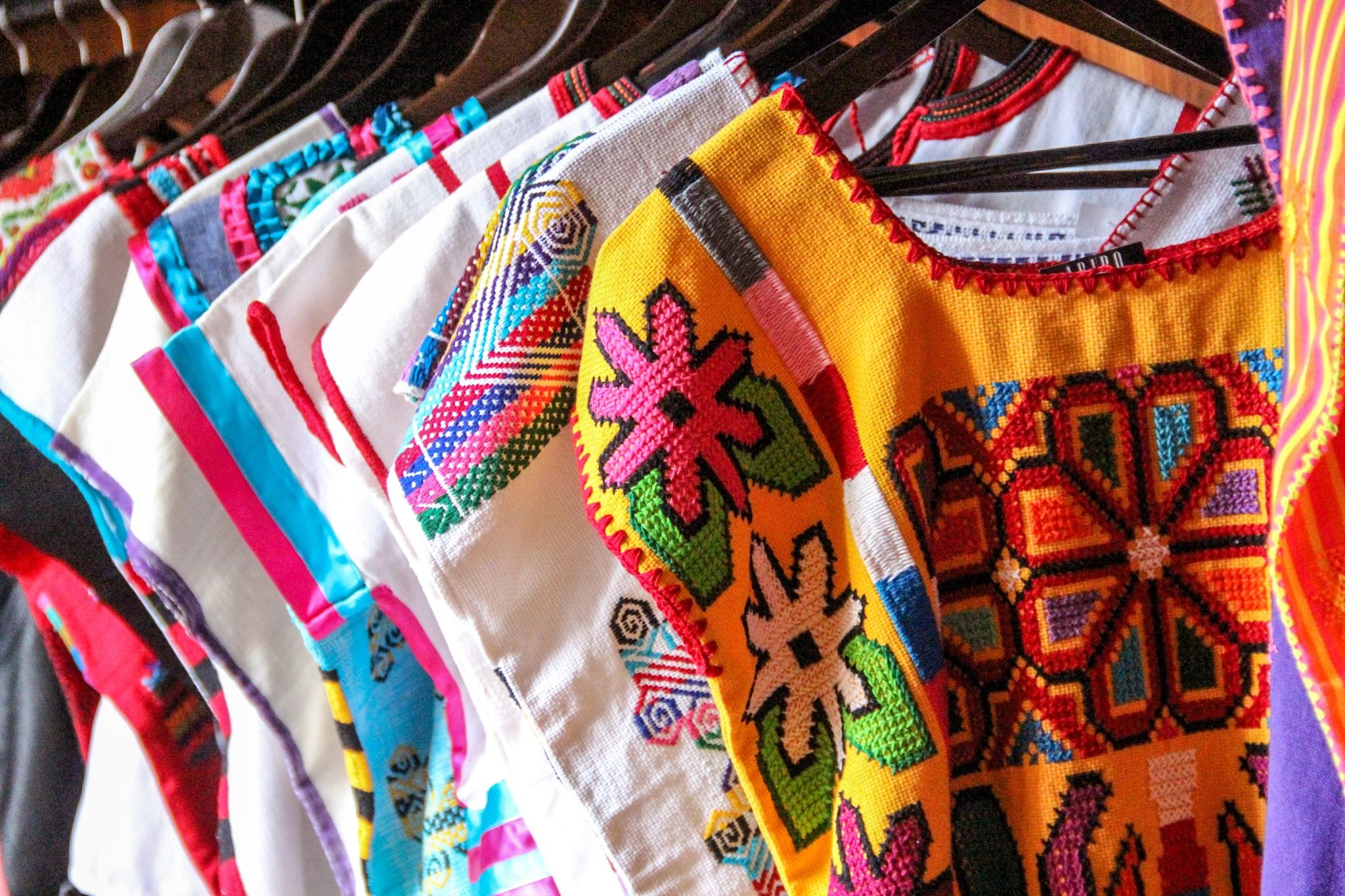 Colorful hand-embroidered traditional blouses on display